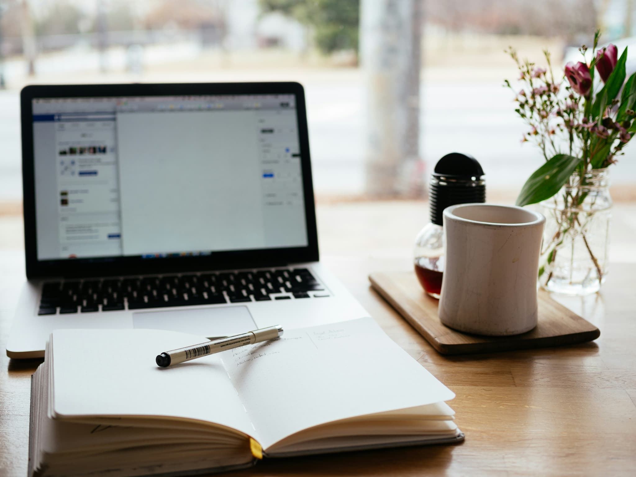 Educational materials about AI concepts on a desk with digital devices